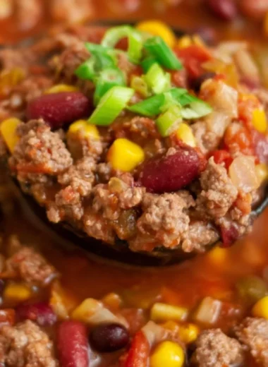 Bowl of delicious Cozy Santa Fe Taco Soup topped with fresh cilantro and cheese