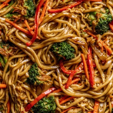 Delicious Cozy Veggie Lo Mein served in a bowl with colorful vegetables