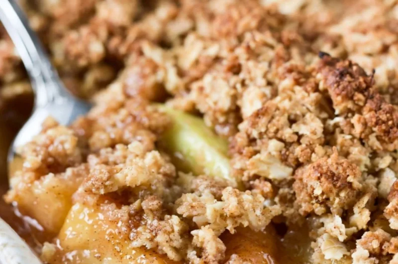 Delicious baked apple crisp topped with crispy oats and served warm