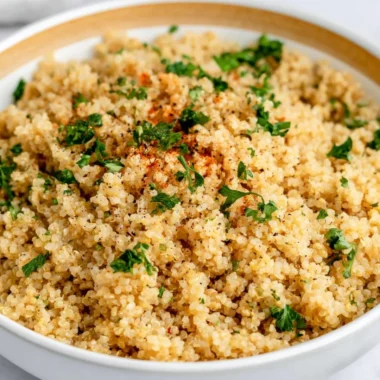Delicious Garlic Butter Quinoa served in a bowl with herbs