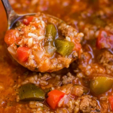 Bowl of delicious Instant Pot Stuffed Pepper Soup topped with fresh herbs