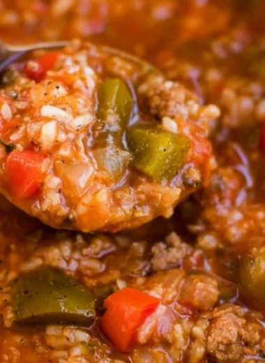 Bowl of delicious Instant Pot Stuffed Pepper Soup topped with fresh herbs