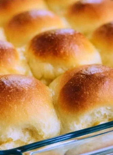 Freshly baked old-fashioned yeast rolls on a wooden table