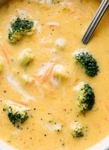 Creamy Broccoli Cheddar Soup garnished with fresh herbs
