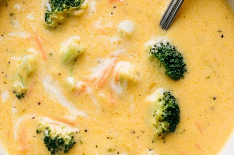 Creamy Broccoli Cheddar Soup garnished with fresh herbs