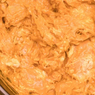 Crockpot Buffalo Chicken Dip served in a bowl with chips on the side
