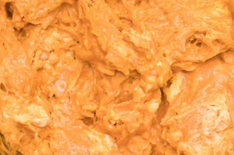 Crockpot Buffalo Chicken Dip served in a bowl with chips on the side