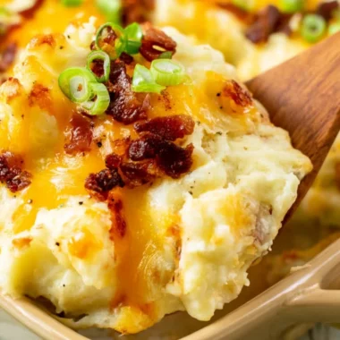Delicious twice baked potato casserole topped with cheese and chives.